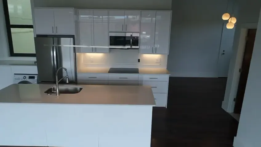 A finished apartment kitchen in the Providence conversion, island and wall run installed