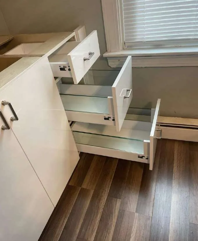 White gloss drawer bank with every drawer open to show the box construction